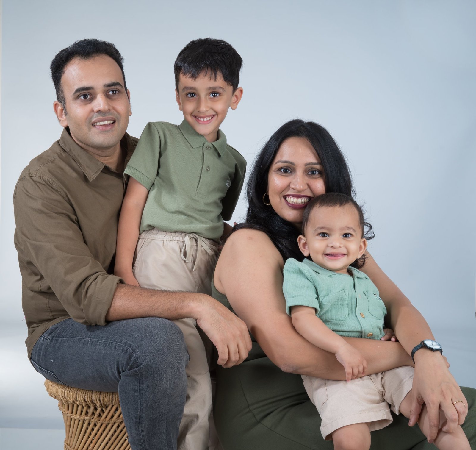 Family of four smiling