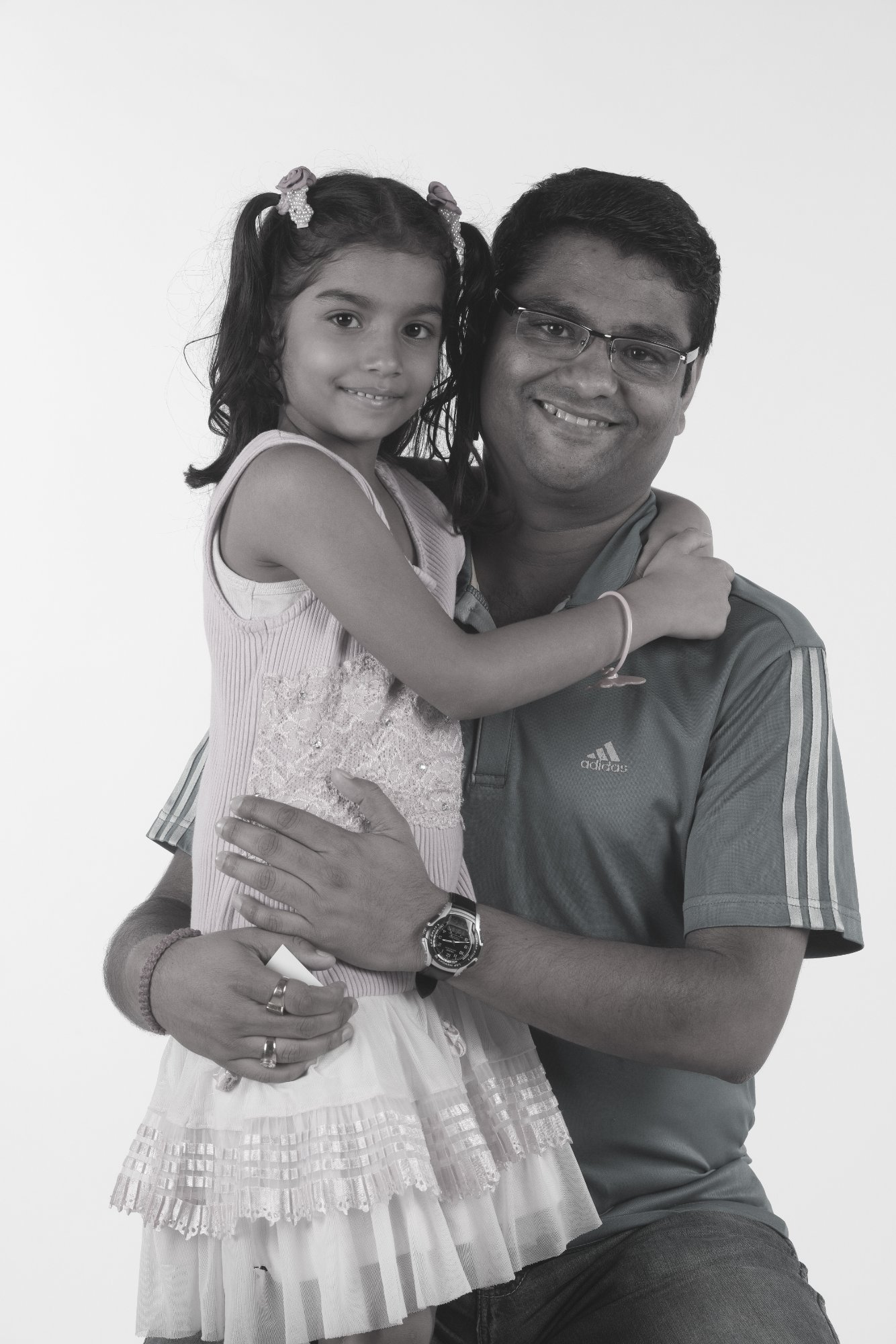 Dad holding daughter B&W